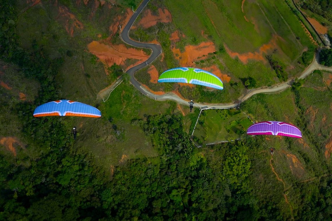 flex wing in three flying in mountain